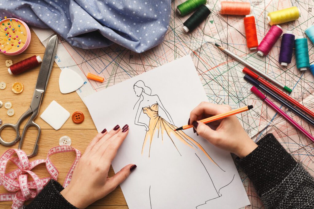 Fashion designer working on dress designs